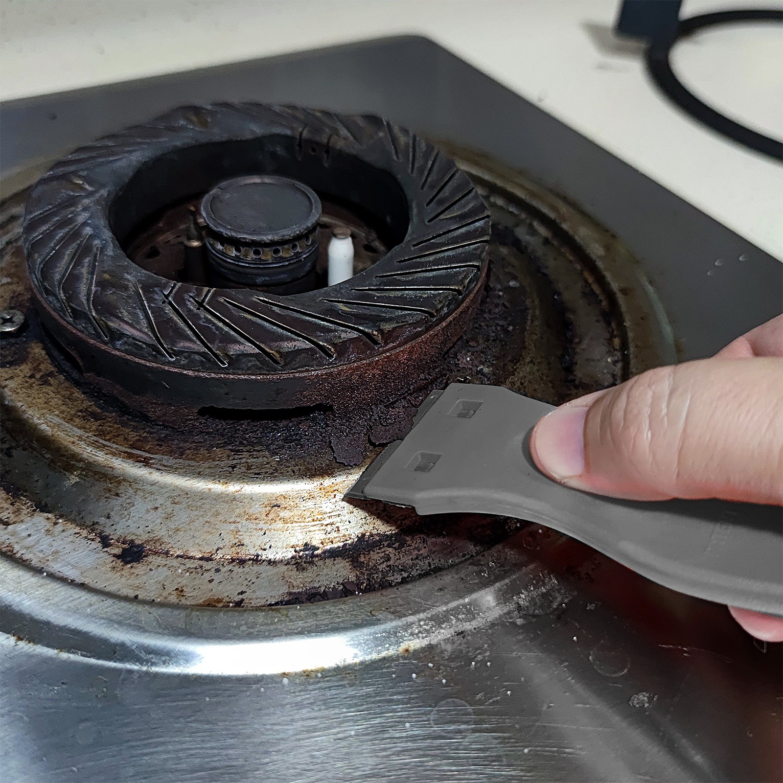 Raspador de cuchillas para estufas